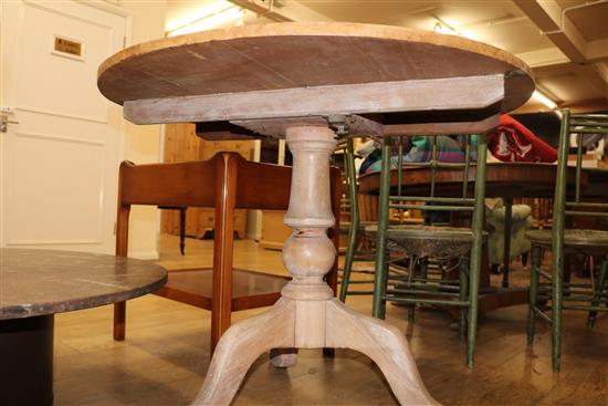 An early 19th century pine tea table
